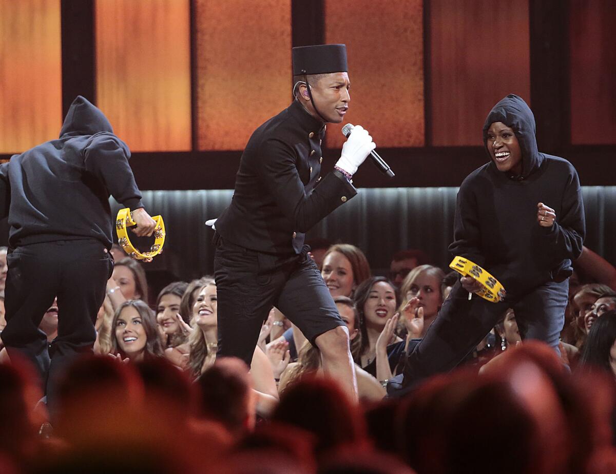 Pharrell Williams performs "Happy" at the 57th Grammy Awards.