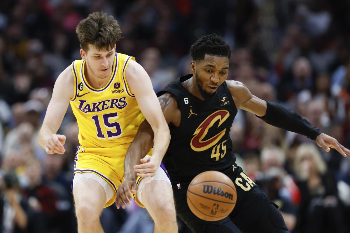 Cleveland Cavaliers guard Donovan Mitchell steals the ball from Lakers guard Austin Reaves.