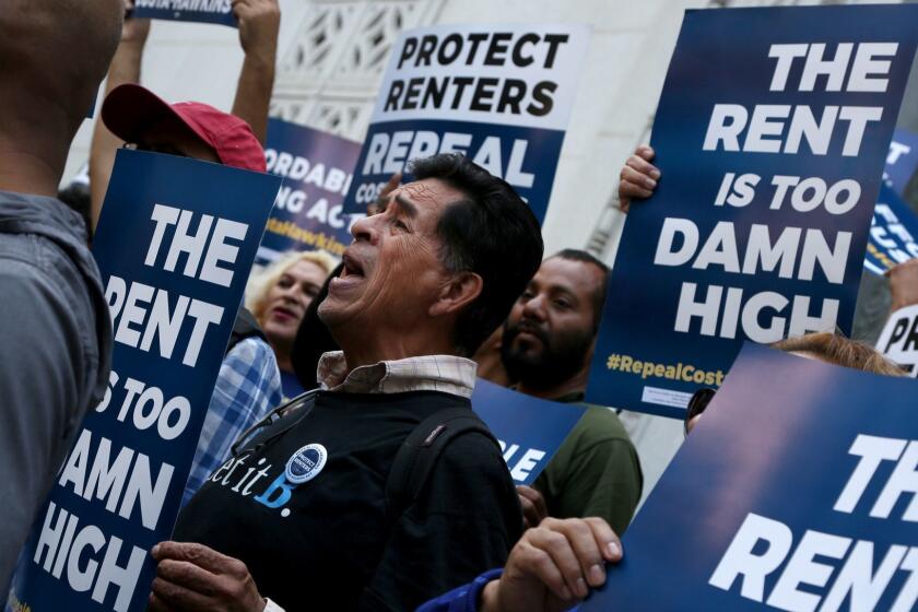 LOS ANGELES, CA-April 23, 2018: Advocates chant on the steps of City Hall before the announcement of a total of over 565,000 voter signatures to County Registrars in all 58 California counties in support of ballot initiative to repeal the Costa-Hawkins Rental Housing Act. Repealing the Costa-Hawkins Rental Housing Act will give local communities a critical tool to tackle the state's housing crisis by allowing them to implement more robust rent control.(Katie Falkenberg / Los Angeles Times)