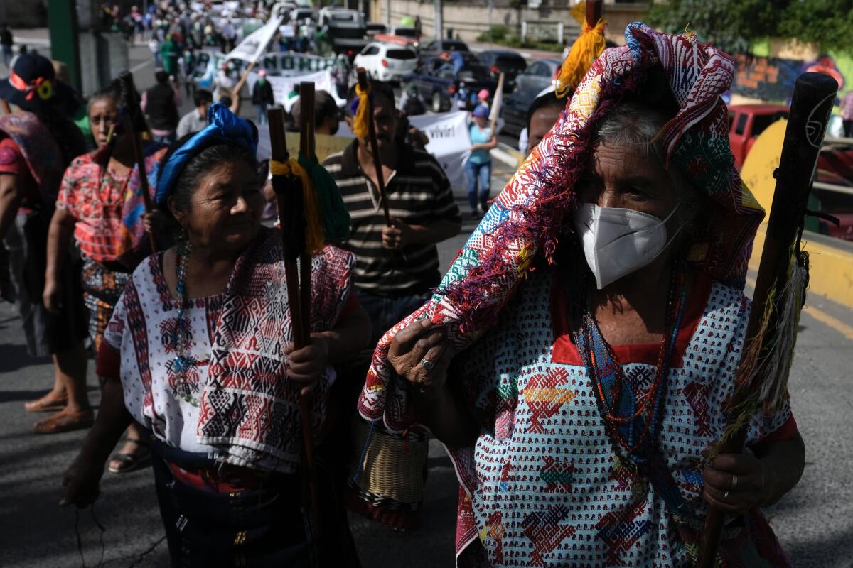 Women join a protest in the streets of Guatemala City