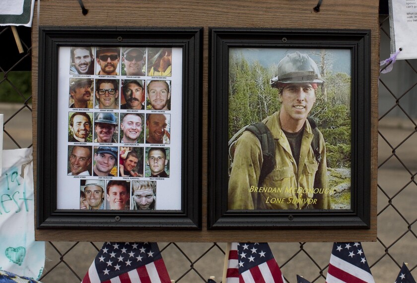 Photos of the 19 fallen Granite Mountain Hotshot firefighters and Brendan McDonough, the lone survivor, in Prescott, Ariz., in 2013.