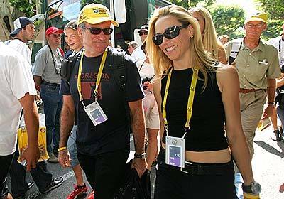 Robin Williams and Sheryl Crow, friend and girlfriend of American Lance Armstrong, head toward the U.S. Postal Service team bus prior to stage 15 of the Tour de France.
