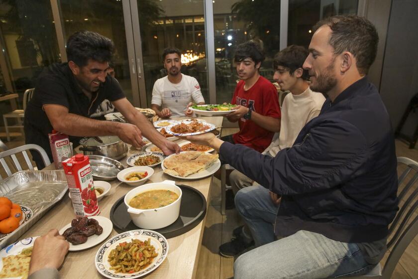Family breaks their first day of Ramadan fasting at local hotel on Saturday, April 2, 2022 in San Diego, CA. 
