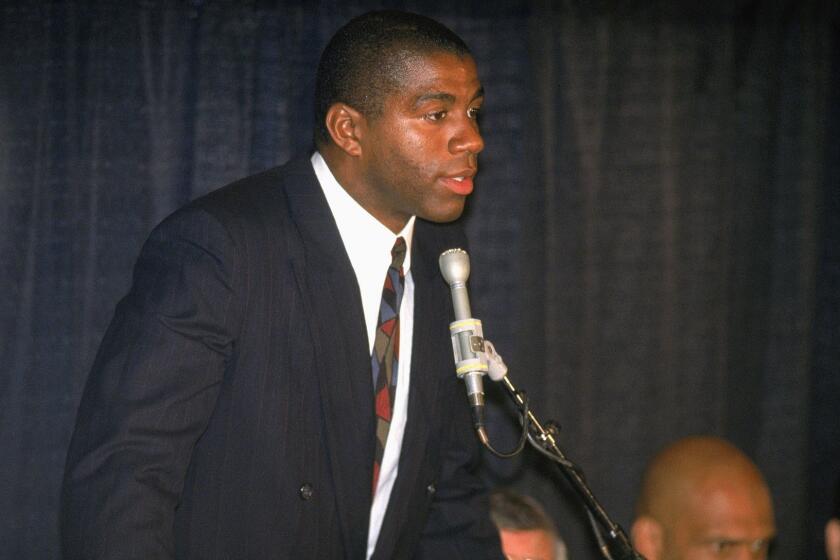 Magic Johnson announces his retirement after being diagnosed as HIV positive.