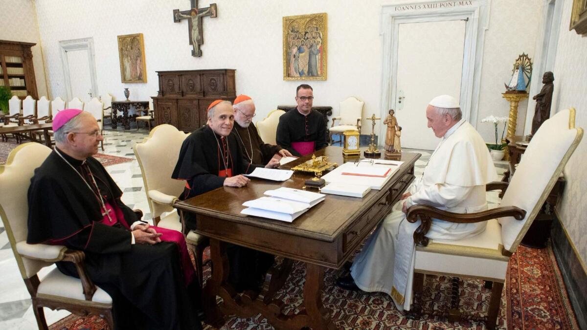 Pope Francis talks with, from left, Archbishop of Los Angeles Jose Horacio Gomez, Cardinals Daniel DiNardo of Galveston-Houston and Sean O'Malley of Boston, and Msgr. Brian Bransfield of the Archdiocese of Philadelphia on Thursday.