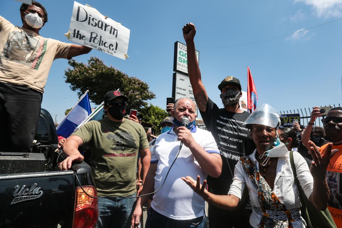 Cristobal Guardado, father of Andres Guardado, speaks at a rally for his son on June 21.