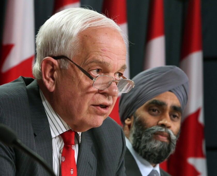 In Ontario, Immigration Minister John McCallum, left, and Harjit Sajjan, minister of National Defense, announce Canada's plan to resettle Syrian refugees.