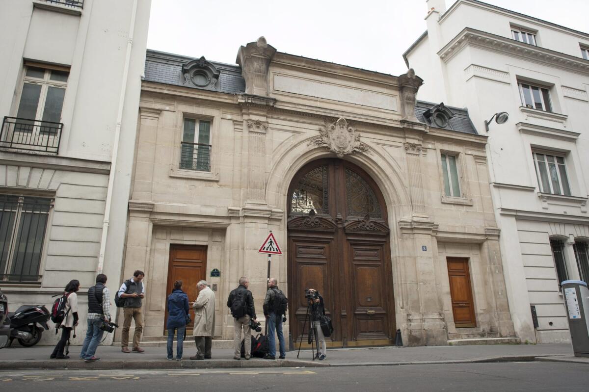 Journalists stand outside Google headquarters in Paris, which was raided on Tuesday in connection with an investigation of alleged tax fraud and money laundering, prosecutors said.