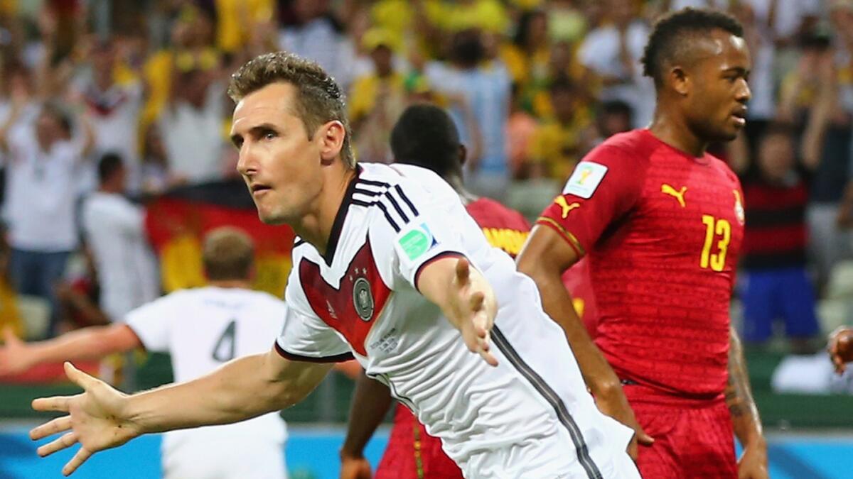 Germany's Miroslav Klose celebrates after scoring against Ghana during the second half of a 2-2 draw in Group G World Cup competition Saturday.