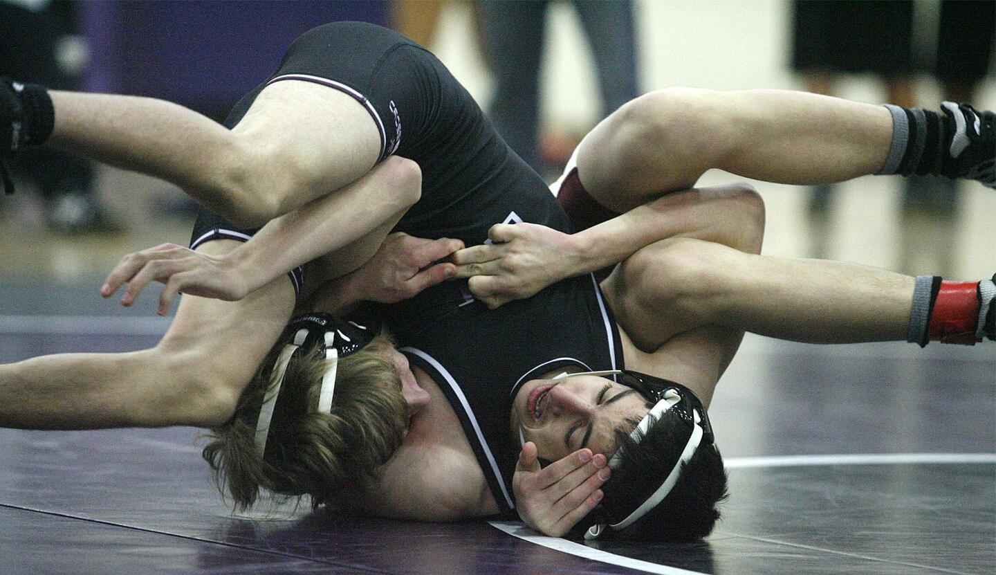 Hoover's David Balakeseyan and eventually pins La Canada's Sean Consolo in the 106 pound weight class in a non-league wrestling match at Hoover High School in Glendale on Tuesday, January 29, 2013.