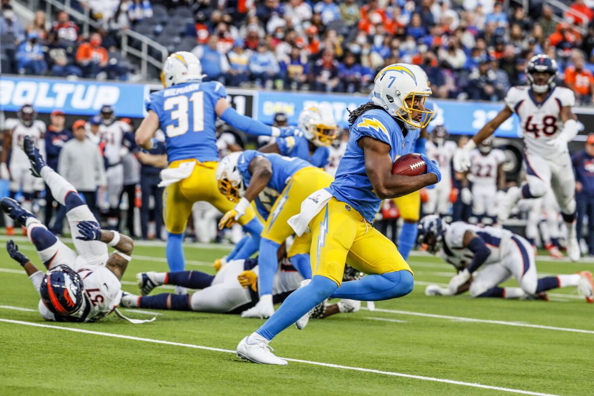 Andre Roberts breaks free to score on a 101-yard kickoff return during the Chargers' 34-13 victory over the Denver Broncos.