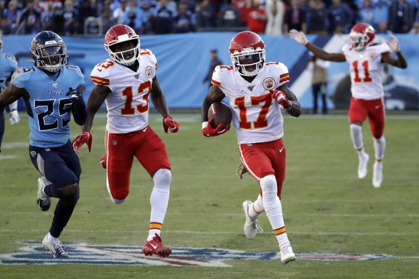 Chiefs receiver Mecole Hardman (17) scores on a 63-yard catch and run against the Titans during a game Nov. 10. 