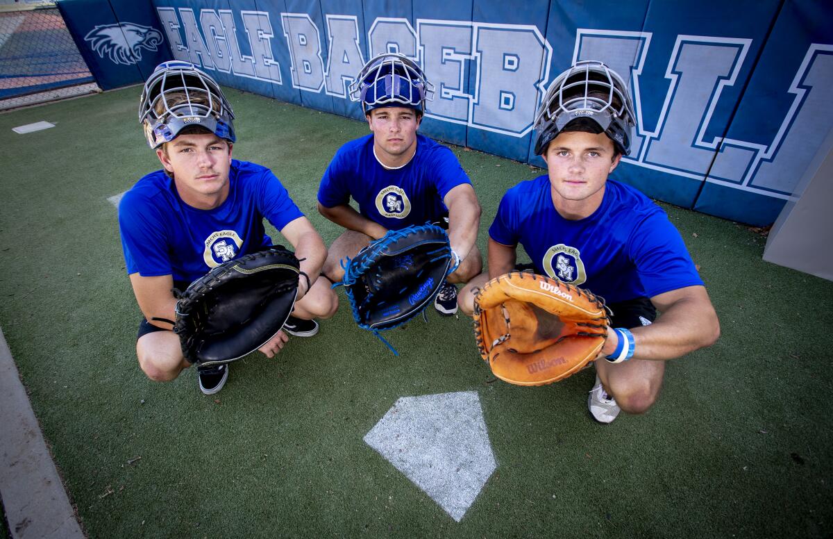Santa Margarita High catchers (from left) Luke Lavin, Blake Balsz and Bryce Humphry pose for a photo.