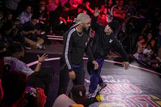 LOS ANGELES, CA - SEPTEMBER 17: Ali (right) competes against Gerson in the Red Bull BC One Cypher USA breakdancing competition on Saturday, Sept. 17, 2022 in Los Angeles, CA. (Jason Armond / Los Angeles Times)