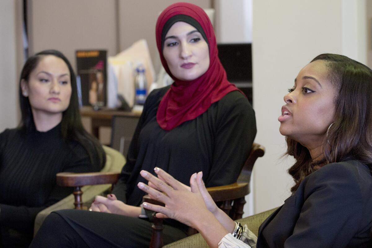 Tamika Mallory, right, co-chair of the Women's March on Washington, with fellow co-chairs Carmen Perez, left, and Linda Sarsour, Jan. 9, 2017 in New York.