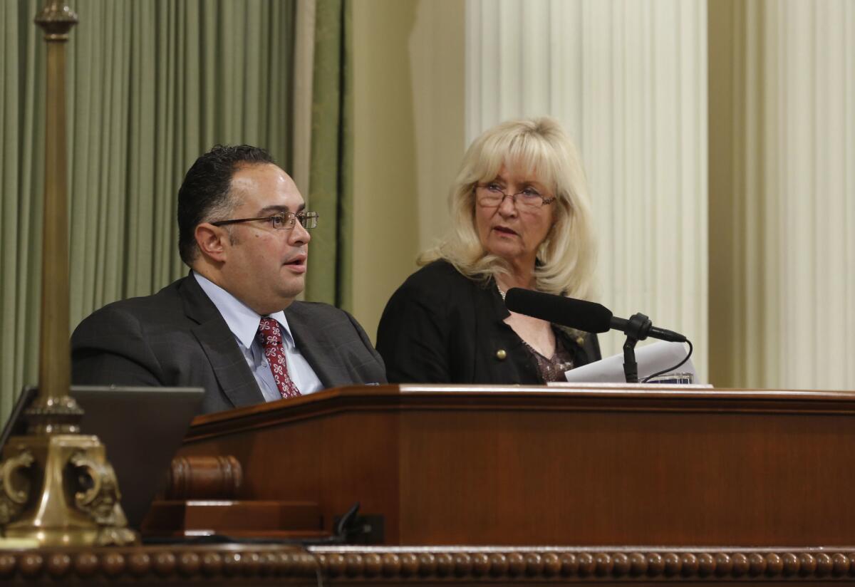 Assembly Speaker John A. Perez, D-Los Angeles, and Assembly Minority Leader Connie Conway, R-Tulare, confer before the Assembly went on its summer recess. The Assembly returned Monday.