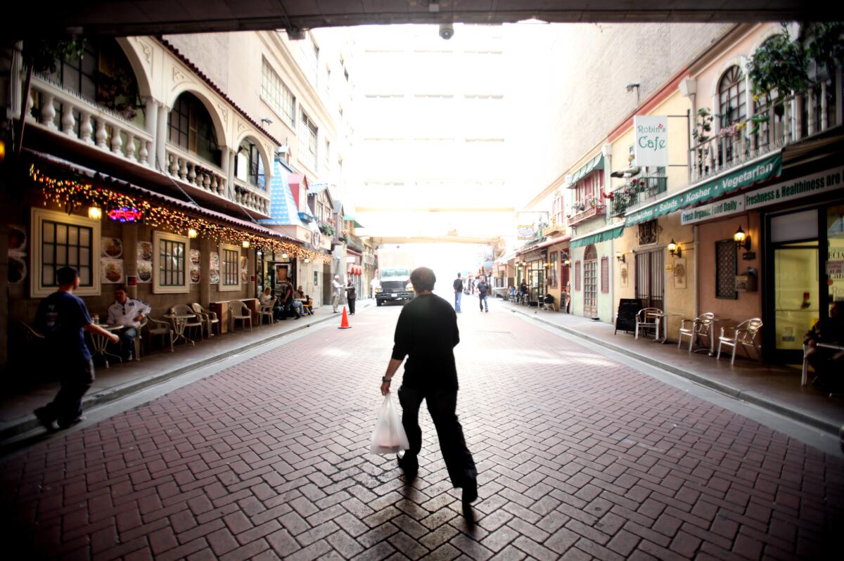 A man walks through St. Vincent Court in downtown L.A.'s jewelry district in 2013.