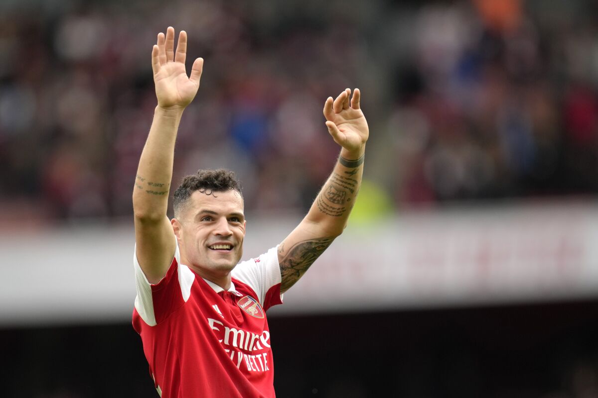 Arsenal's Granit Xhaka celebrates their victory at the English Premier League soccer match between Arsenal and Crystal Palace at Emirates stadium in London, Sunday, March 19, 2023. (AP Photo/Kirsty Wigglesworth)