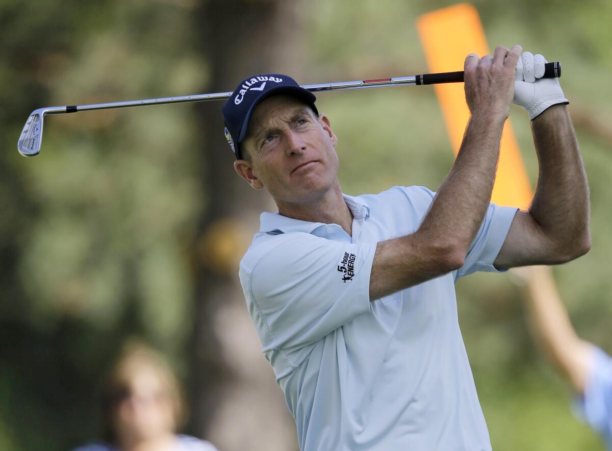 Jim Furyk tees off on the 12th hole during the second round of the Bridgestone Invitational golf tournament.