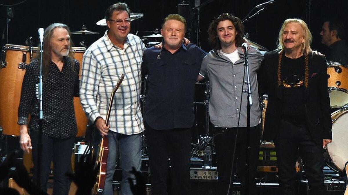 Timothy Schmit, left, Vince Gill, Don Henley, Deacon Frey and Joe Walsh at a 2017 Eagles concert in Nashville.