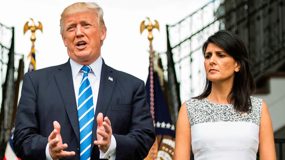 President Donald Trump speaks to the press with Ambassador to the United Nations Nikki Haley on Aug. 11, 2017.
