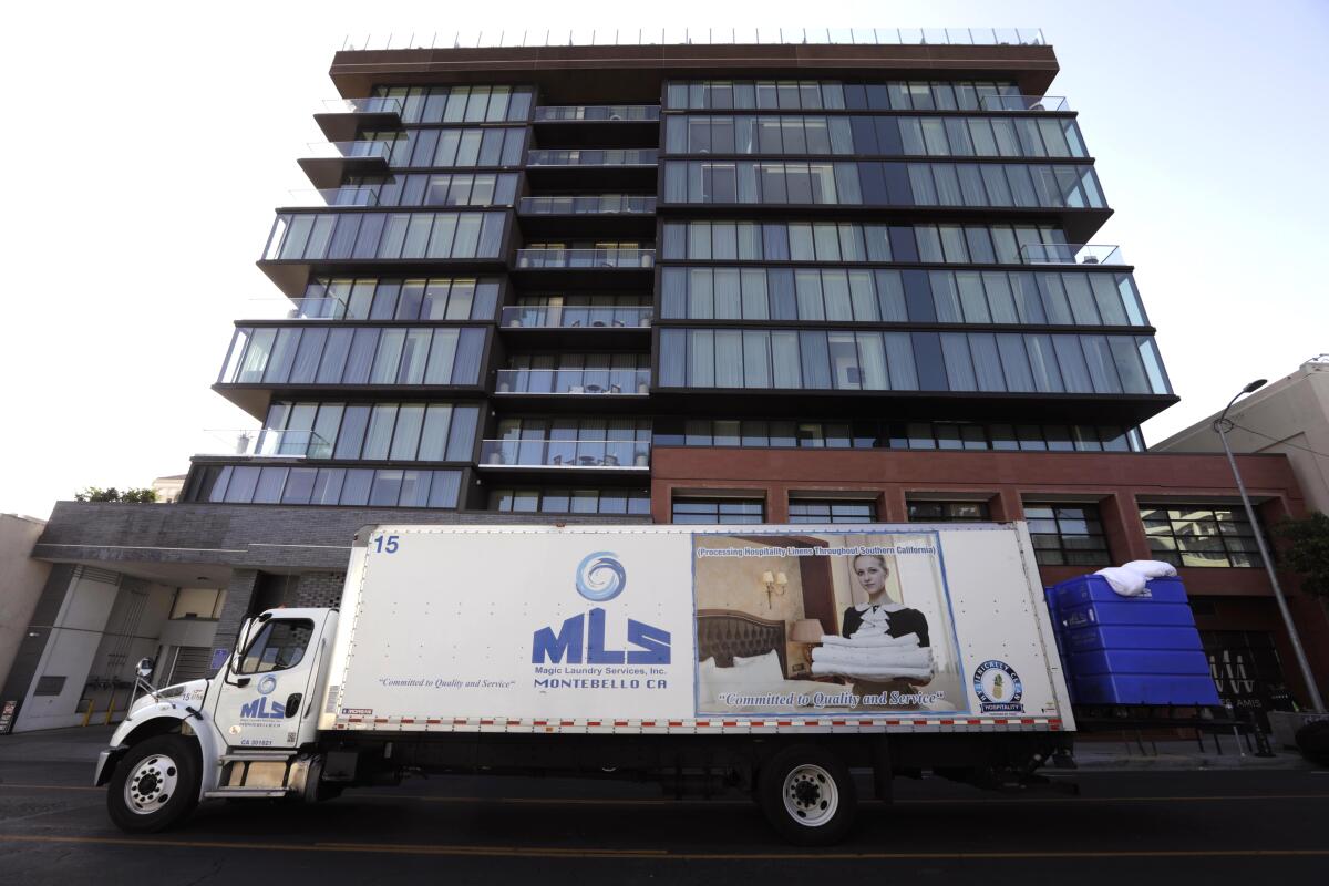 A truck passing a building.