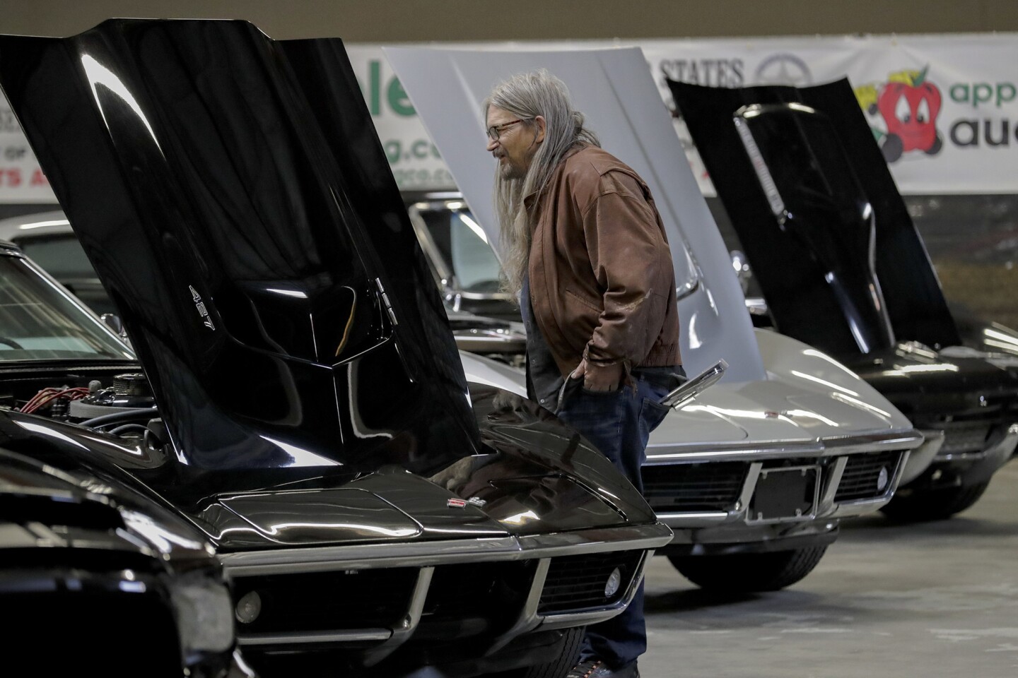 Alan Moskovitz, 65, checks out Corvettes on the auction block at Apple Auctioneering Co., which manages government assets and auctions them off online.