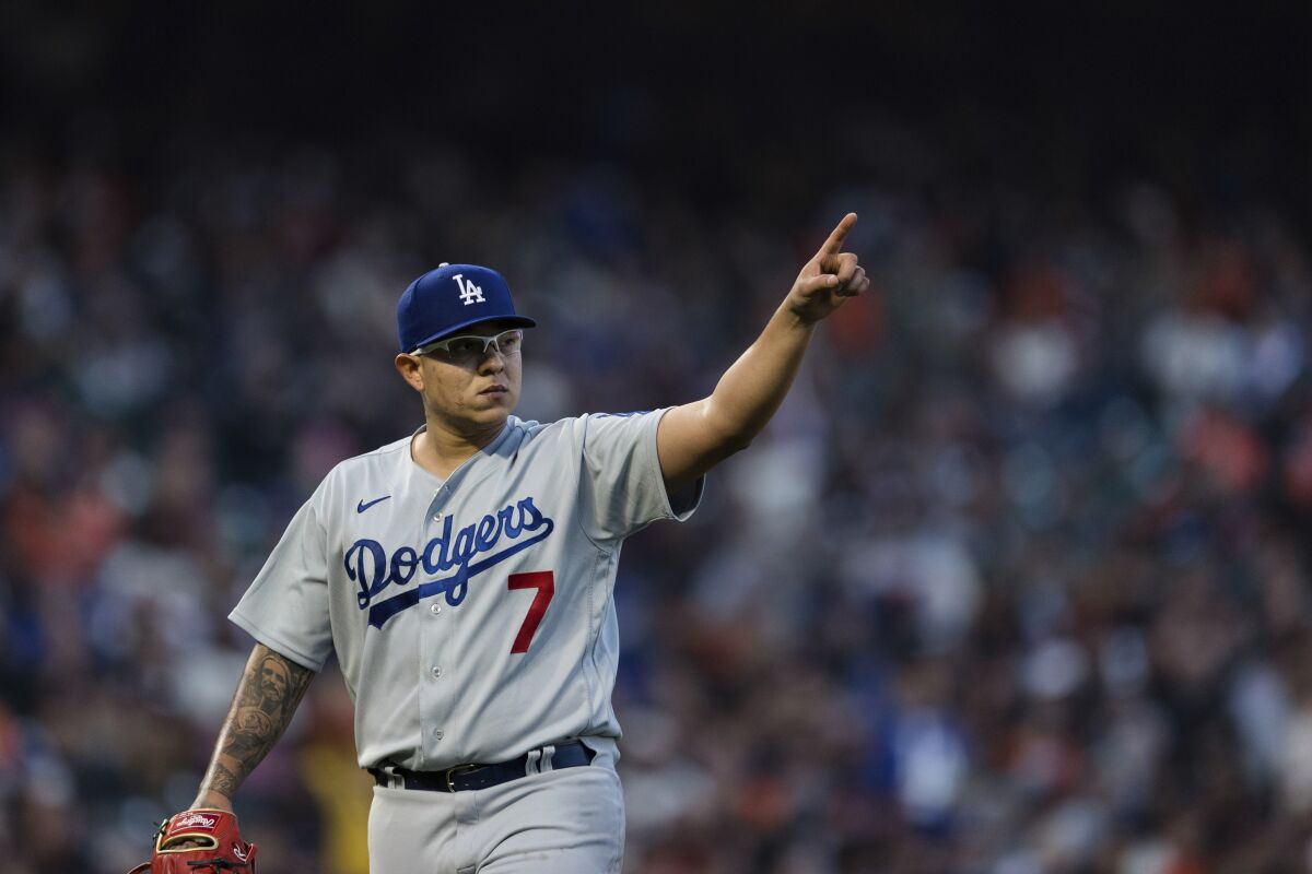 Dodgers starting pitcher Julio Urías gestures at the end of the third inning Saturday.