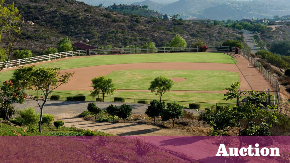 The sports compound includes a baseball field, a basketball half-court, a lighted batting cage, horse facilities and a pool on 42 acres in Poway.