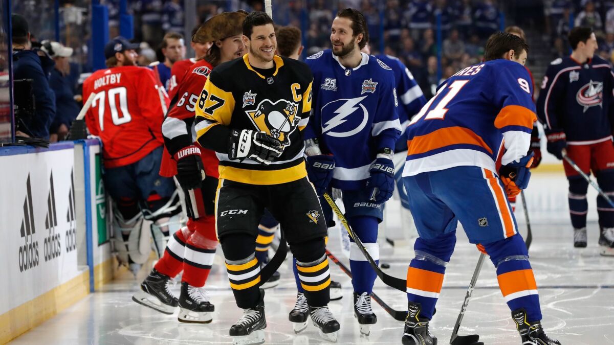 Sidney Crosby (87) of the Pittsburgh Penguins and Nikita Kucherov of the Tampa Bay Lightning warm up prior to the NHL All-Star Skills Competition at Tampa, Fla.