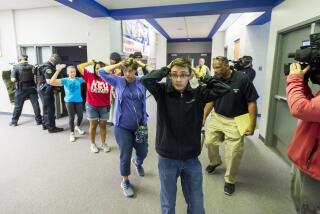 FILE - In this Friday June 9, 2017 file photo, students are led out of school as members of the Fountain Police Department take part in an Active Shooter Response Training exercise at Fountain Middle School in Fountain, Colo. The nation's two largest teachers unions want schools to revise or eliminate active shooter drills, asserting Tuesday, Feb. 11, 2020 that they can harm students' mental health and that there are better ways to prepare for the possibility of a school shooting. (Dougal Brownlie/The Gazette via AP, File)
