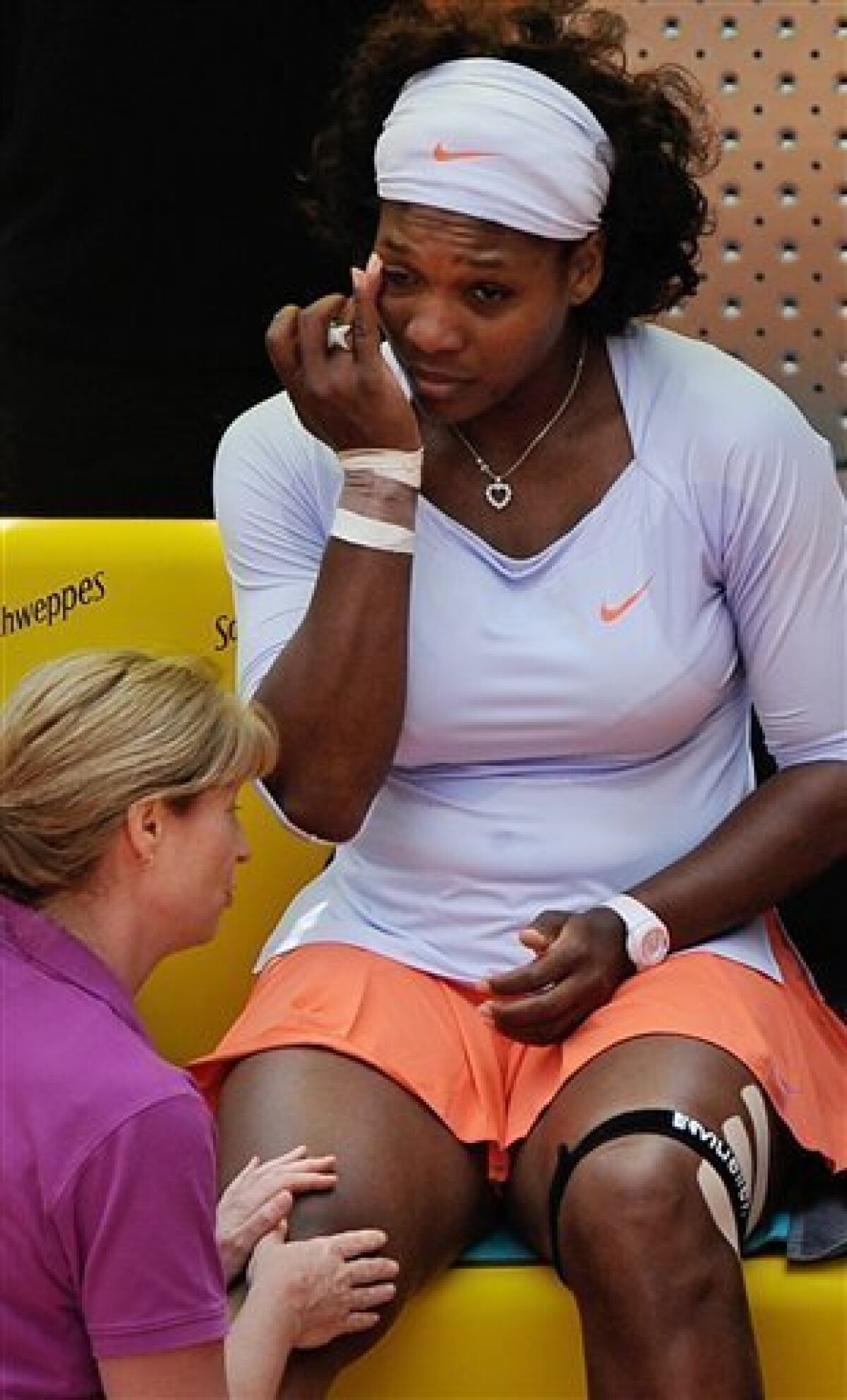 U.S. player Serena Williams is seen moments before retiring during her Madrid Open Tennis match against Francesca Schiavone from Italy in the Caja Magica in Madrid, Monday May 11, 2009.(AP Photo/Daniel Ochoa de Olza)