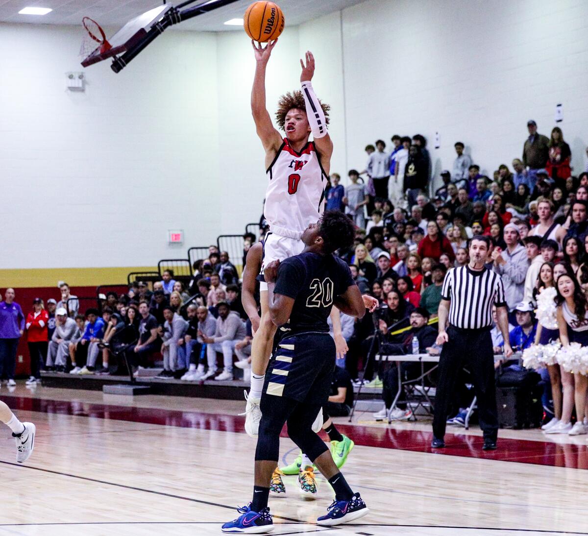 Harvard-Westlake's Trent Perry shoots over Sherman Oaks Notre Dame's Dante Ogbu.