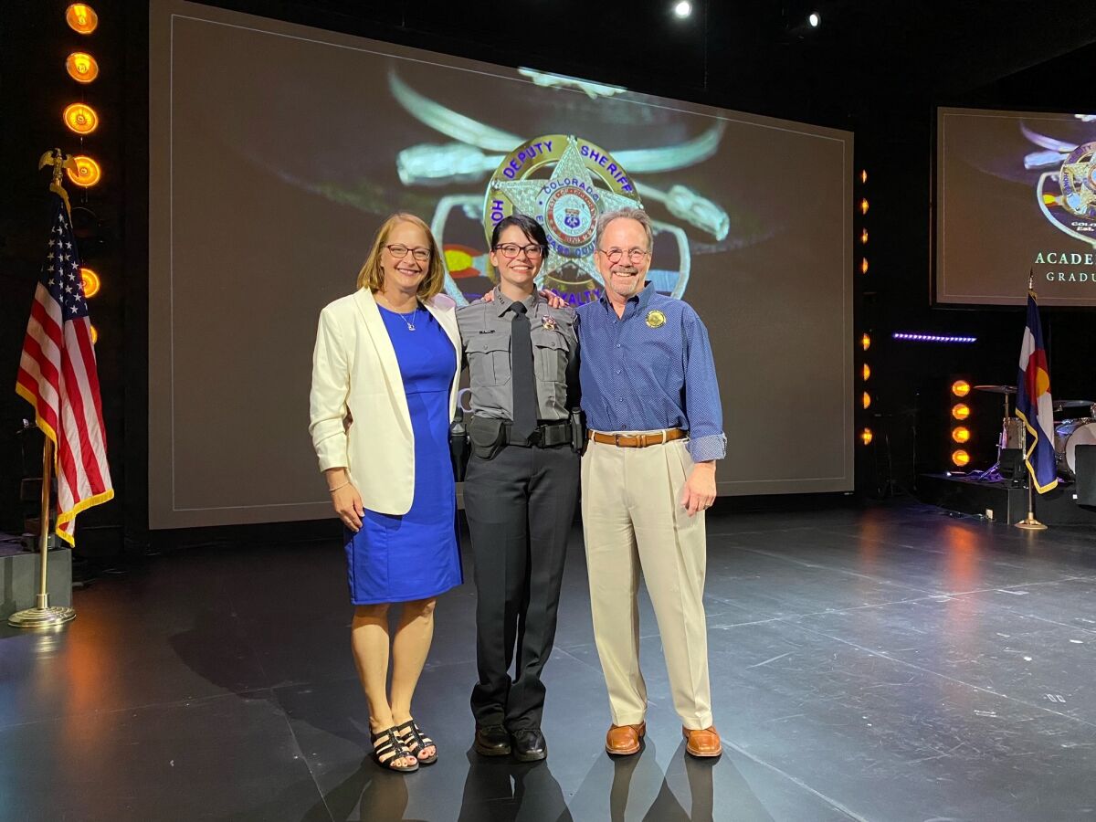 Parents Shelley and Jeff Young with their daughter Natalie Young, center.