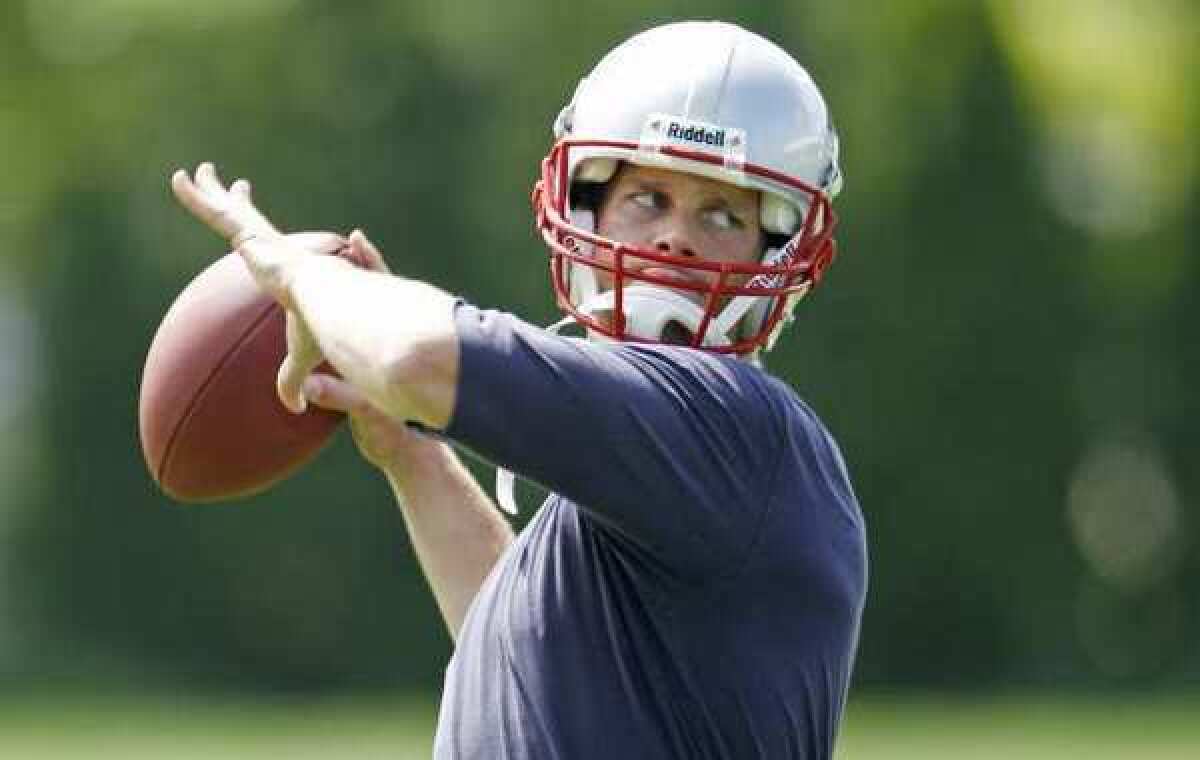 New England Patriots quarterback Tom Brady throws during a team workout Thursday in Foxborough, Mass.