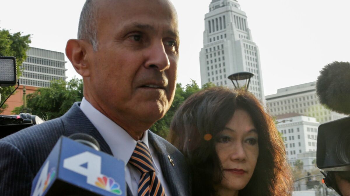 Former L.A. County Sheriff Lee Baca and his wife, Carol Chiang, arrive at federal court earlier this week in Baca's obstruction of justice trial.