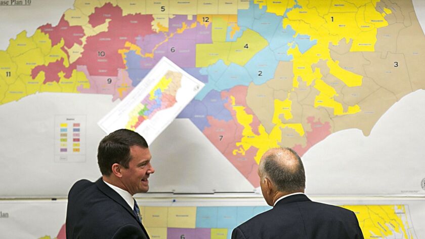 Republican state Sens. Dan Soucek, left, and Brent Jackson review North Carolina maps during a special session in 2016 to draw election boundaries.