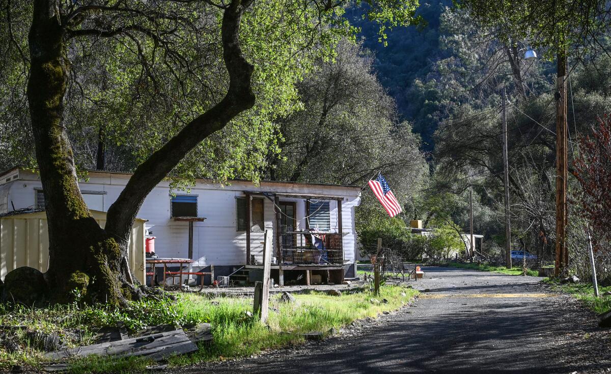 Mobile homes line a quiet street in the El Portal Trailer Park near Yosemite National Park.