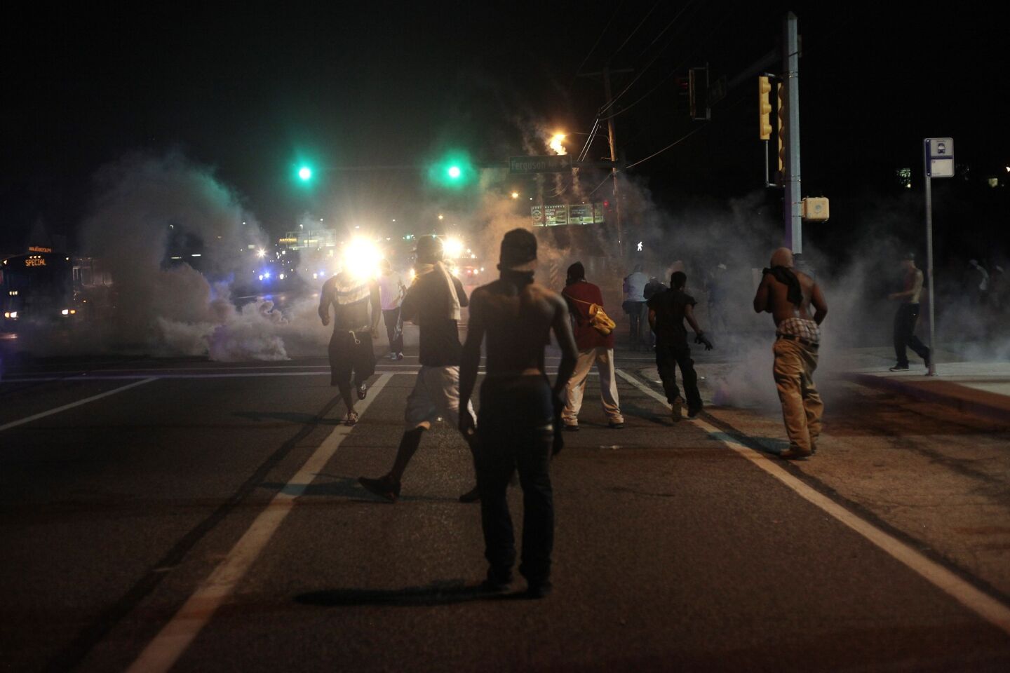 Tear gas and smoke waft around the site of a protest Sunday.