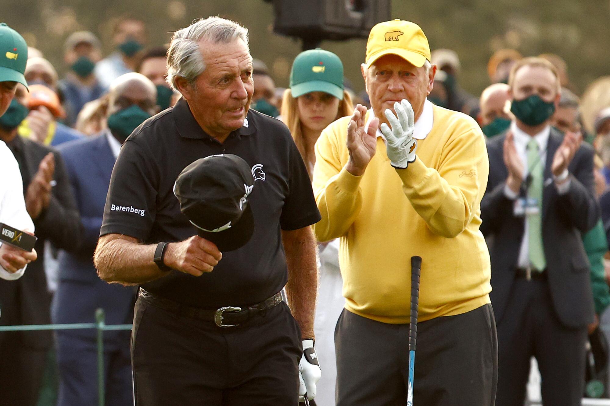 Gary Player doffs his cap as Jack Nicklaus applauds 