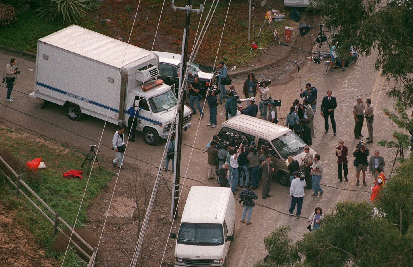 County medical examiner personnel leave after removing some of the 39 bodies of Heaven's Gate members found inside a Rancho Santa Fe mansion on March 26, 1997.
