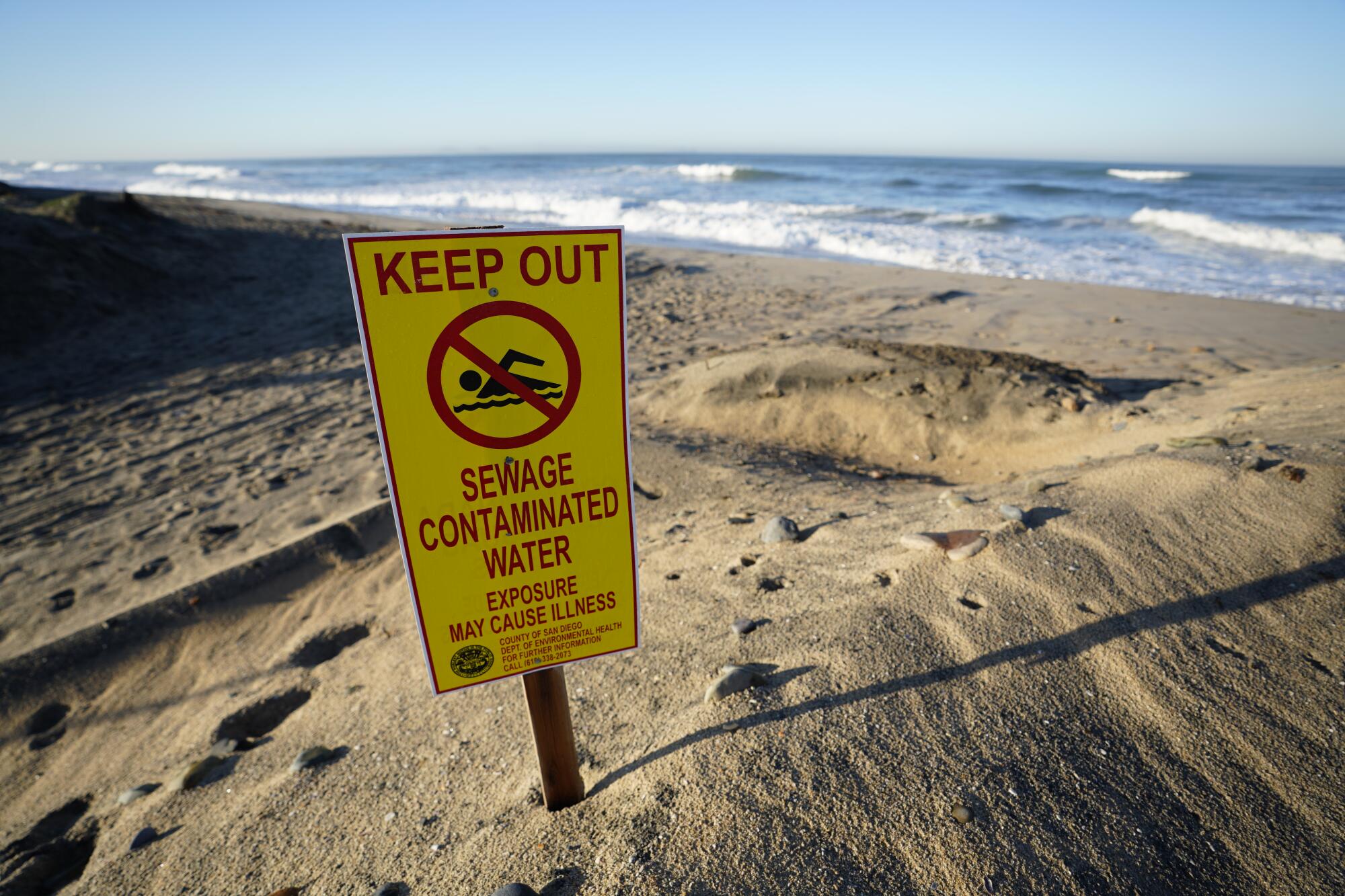 Contaminated water signs posted along the southern part of the Imperial Beach in 2019.