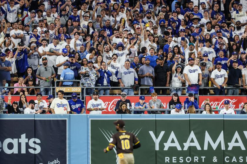 Los Angeles, CA, Sunday, October 6, 2024 - Padrews left fielder Jurickson Profar suffers the derision of fans in the bleachers in game two of the National League Division Series at Dodger Stadium. (Robert Gauthier/Los Angeles Times)