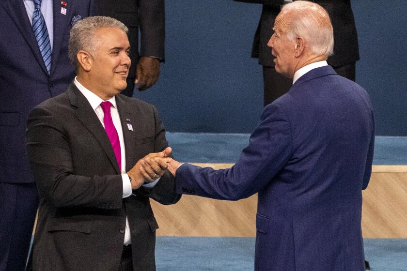Los Angeles, CA - June 10: President of Colombia Ivan Duque Marquez, left, US President Joe Biden, speaking following the group photo of leaders at the IX Summit of the Americas at the LA Convention Center in Los Angeles on Friday, June 10, 2022. (Francine Orr/ Los Angeles Times)