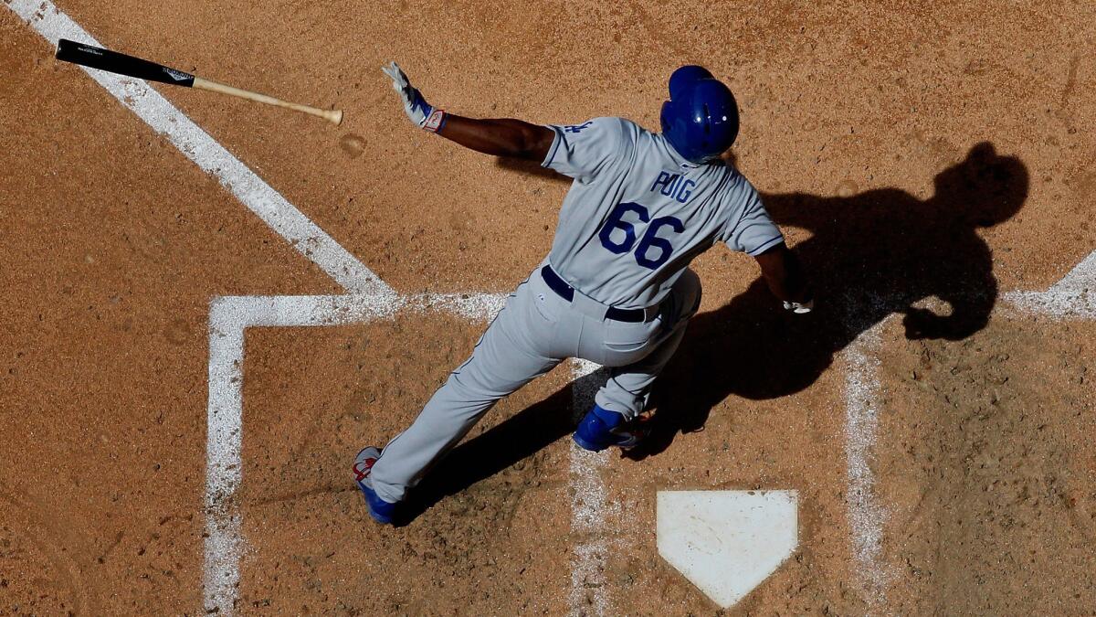 Dodgers right fielder Yasiel Puig hits a solo home run during a win over the Arizona Diamondbacks in Phoenix on April 12.
