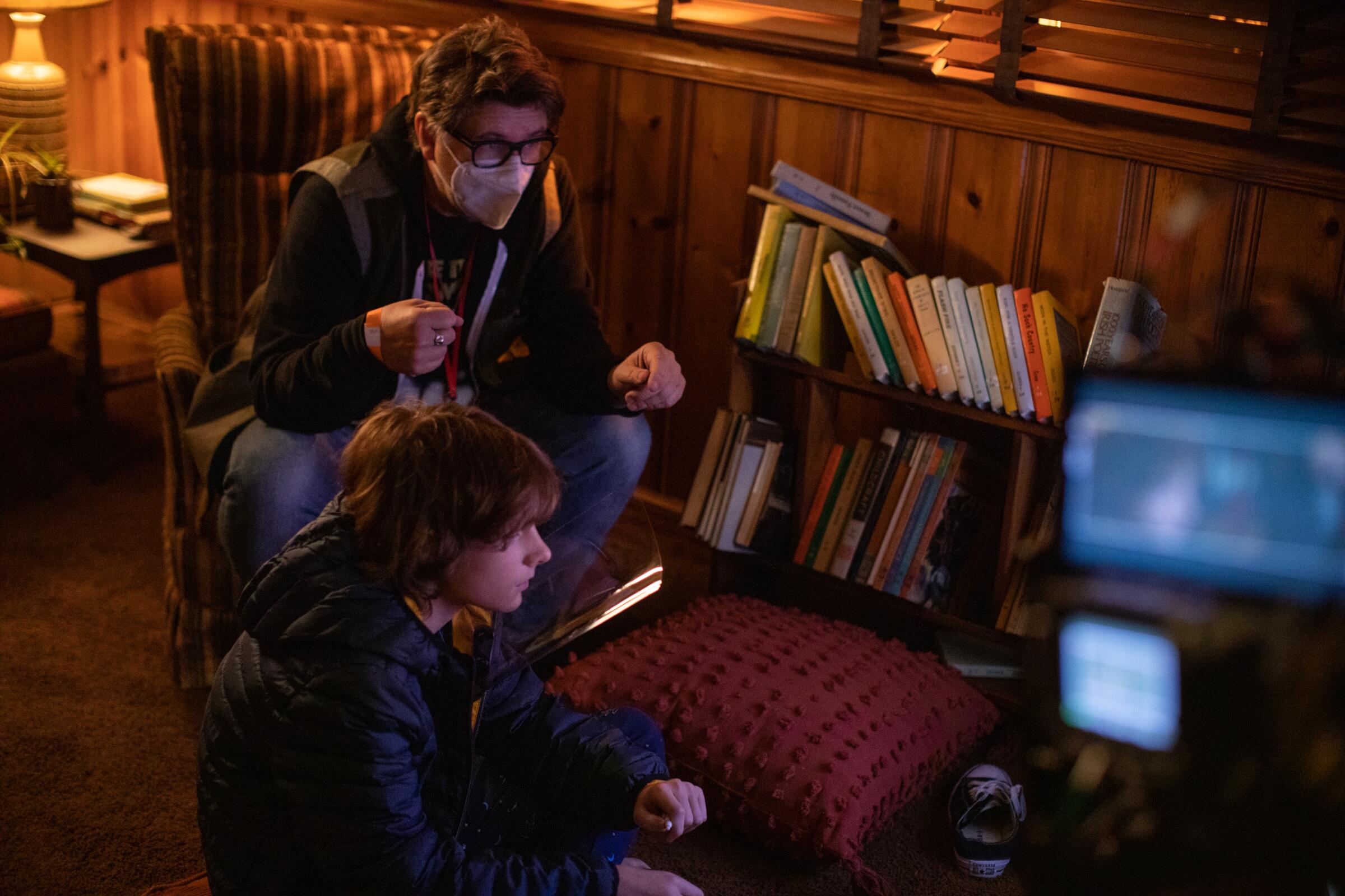 Director Scott Derrickson and Mason Thames on the set of Universal Pictures' "The Black Phone."