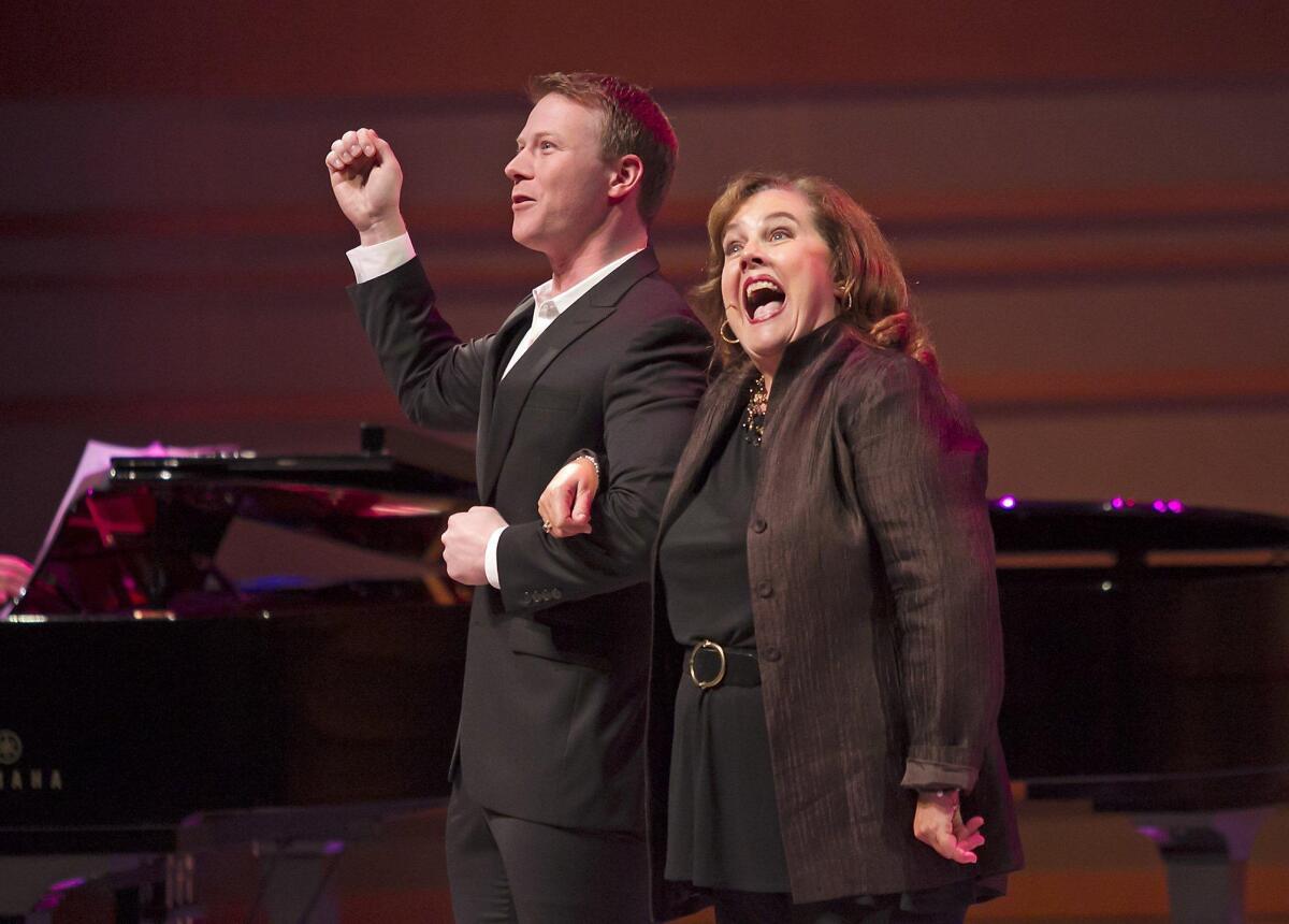 Jeff Kready, left, and Mary VanArsdel, right, perform the song “You're a D'Ysquith” from “A Gentleman’s Guide to Love and Murder” during a season preview night at the Renee and Henry Segerstrom Concert Hall on Monday.