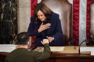 WASHINGTON, DC - DECEMBER 21: President of Ukraine Volodymyr Zelensky greets U.S. Vice President Kamala Harris and Speaker of the House Nancy Pelosi (D-CA) as he addresses a joint meeting of Congress in the House Chamber of the U.S. Capitol on December 21, 2022 in Washington, DC. In his first known trip outside of Ukraine since Russia invaded, Zelensky met with U.S. President Joe Biden and outlined Ukraine's request for continued military aid. (Kent Nishimura / Los Angeles Times)