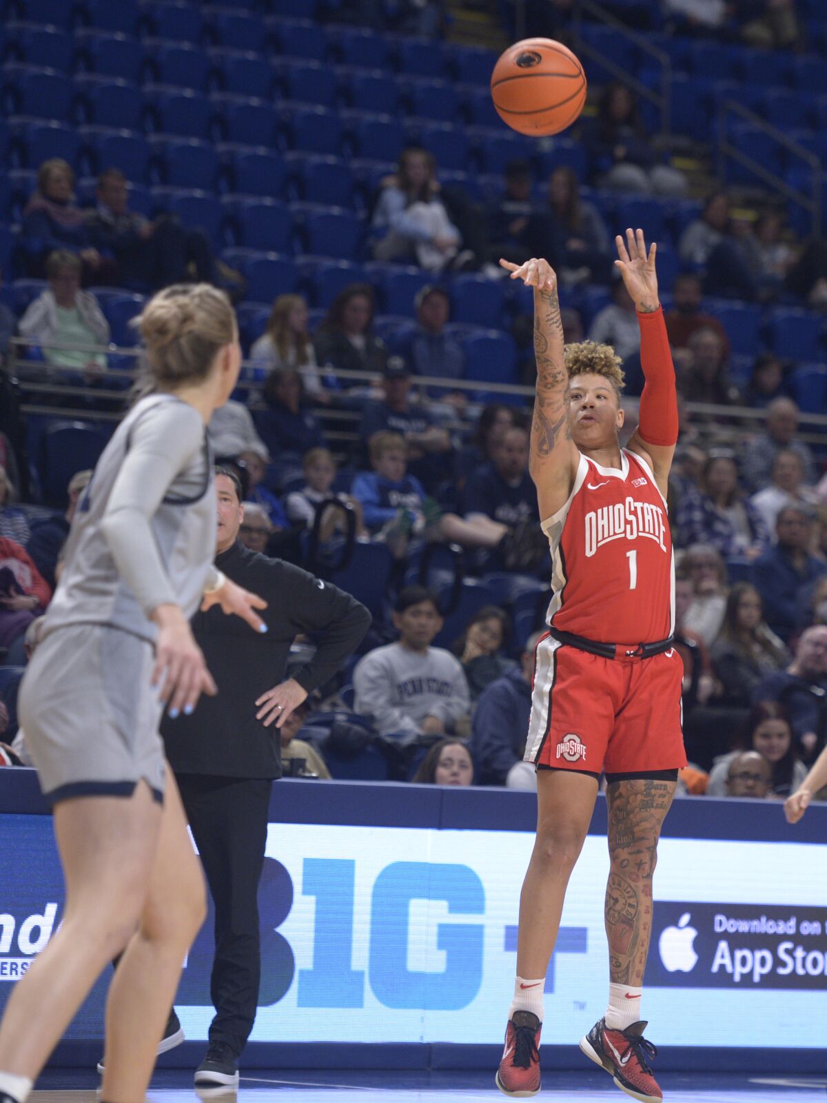 Ohio State's Rikki Harris (1) shoots a long 3-point basket against Penn State during the second half of an NCAA college basketball game, Thursday, Feb. 16, 2023, in State College, Pa. (AP Photo/Gary M. Baranec)