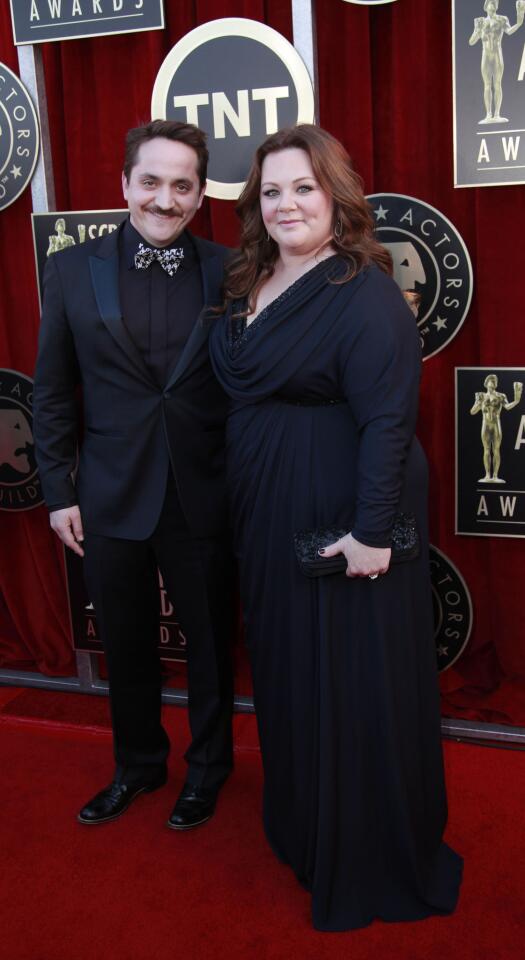 Melissa McCarthy and husband Ben Falcone. She's nominated for female actor in a supporting role for "Bridesmaids." Both are in the the film, up for cast in a motion picture.
